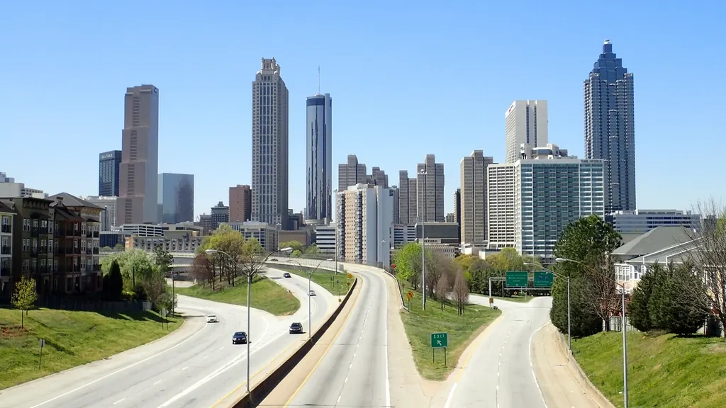 Midtown Atlanta skyline seen across the meadow of Piedmont Park
