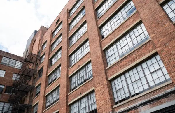Brick loft building with large industrial windows