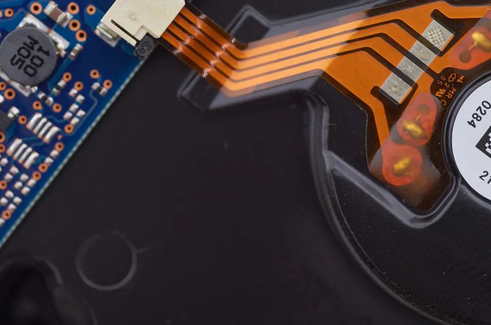 Close-up of a circuit board and ribbon cable