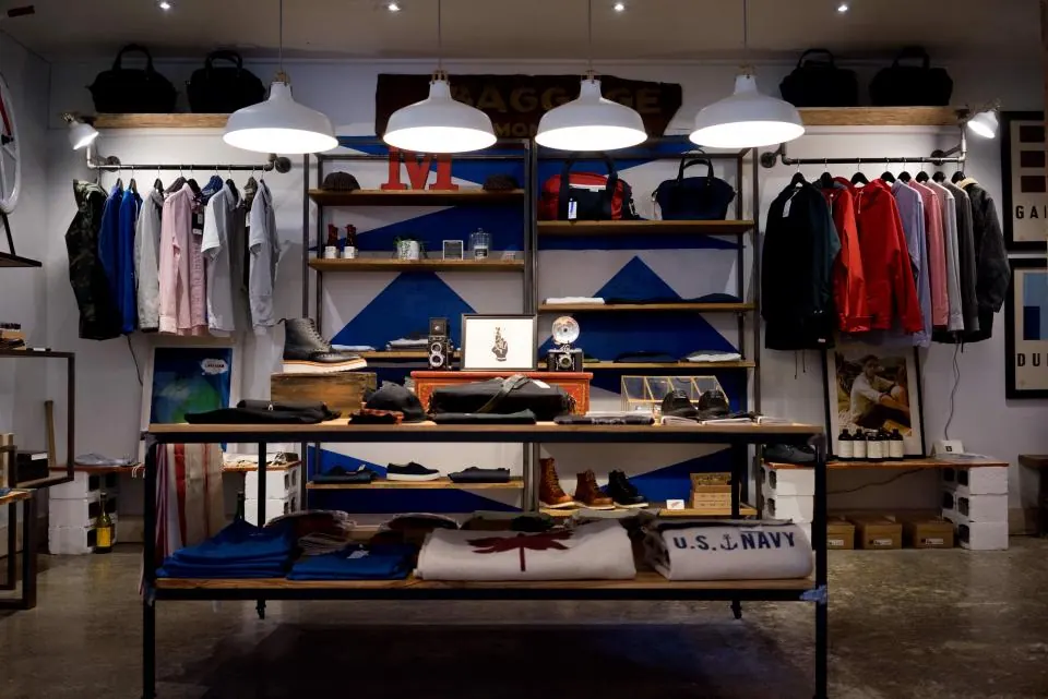 Retail store with folded shirts and clothing on display