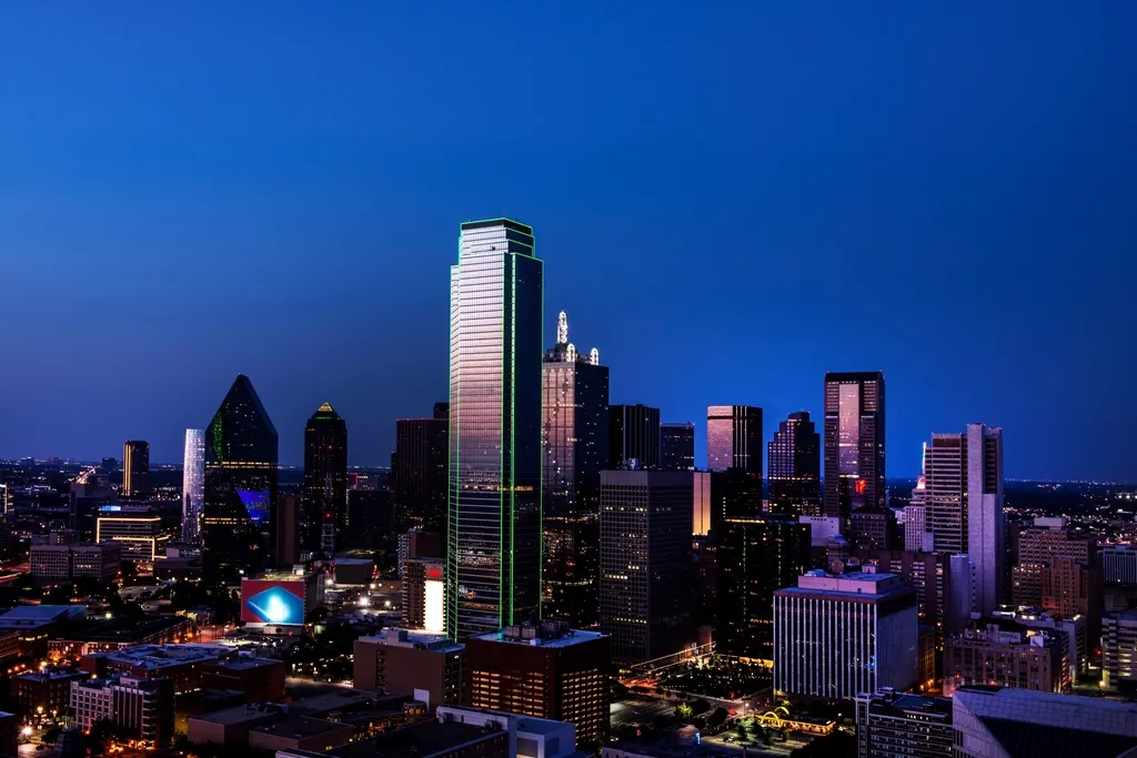 Dallas downtown skyline with Reunion Tower lit at dusk
