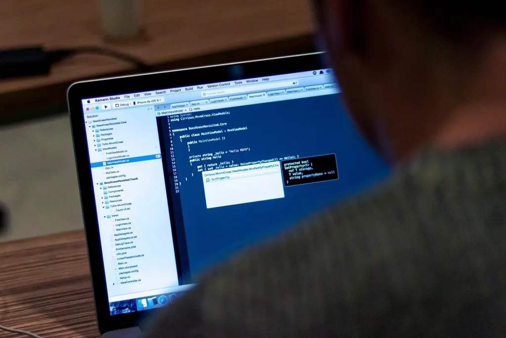 Developer writing code in an editor on a laptop screen