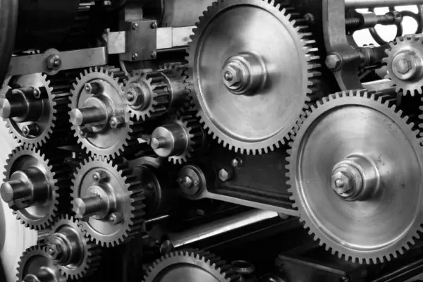 Interlocking metal gears inside a machine