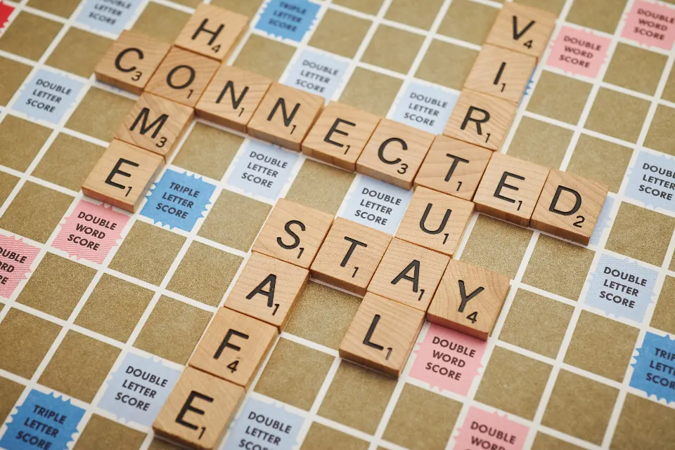 Letter tiles on a game board spelling the word connected