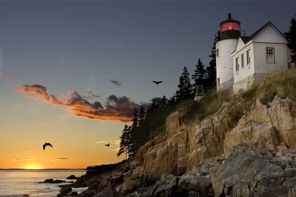 Lighthouse on the rocky Maine coast above the Atlantic