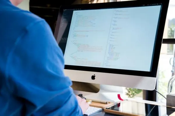 Man working at a desktop computer in an office