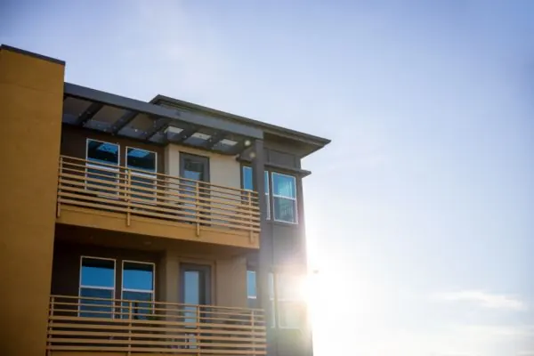 Modern apartment block with balconies in sunlight