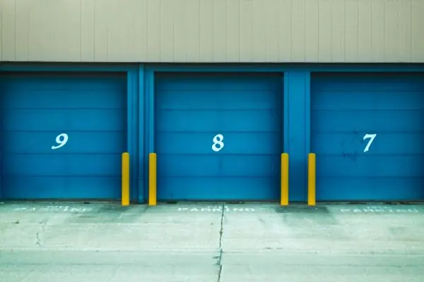 Numbered blue loading dock doors on a warehouse