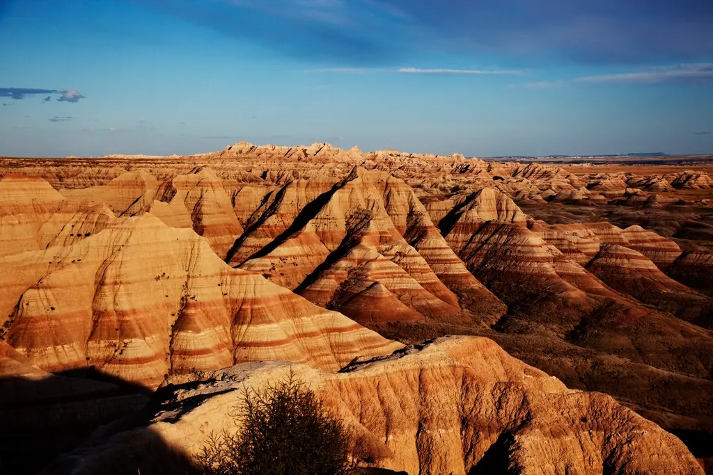 Eroded Badlands ridges in South Dakota glowing at sunset