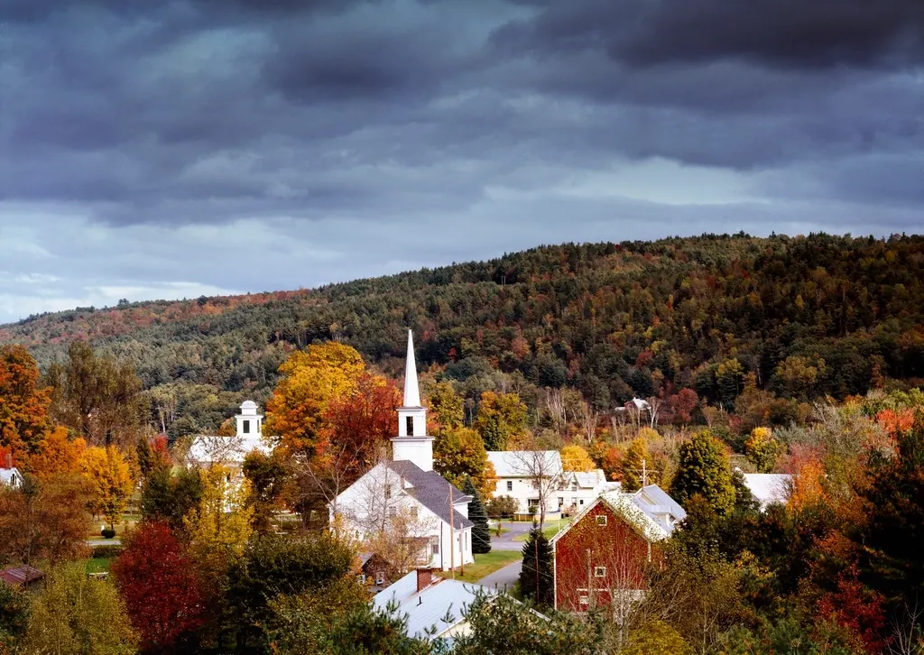 A Vermont village with a white church in autumn