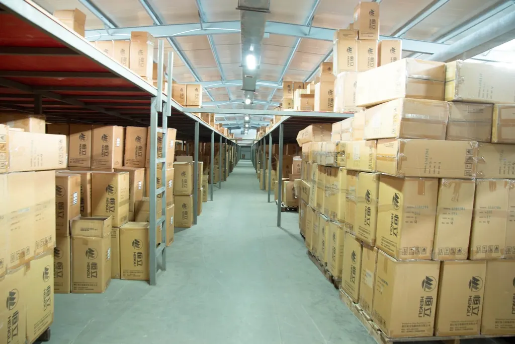 Warehouse aisle with cartons stacked on both sides