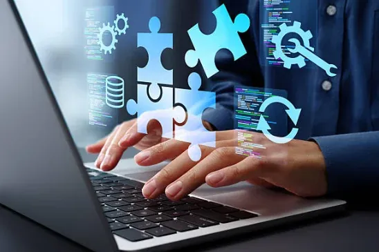Person typing on a laptop with automation and app icons overlaid