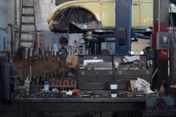 Workshop benches lined with tools and machinery