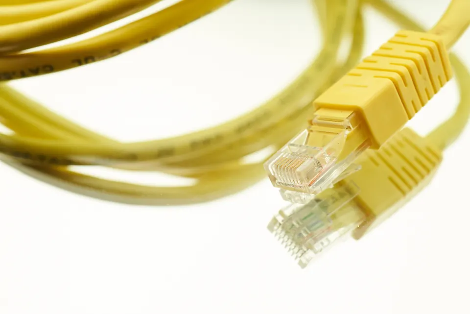 Yellow network cable with an RJ45 plug